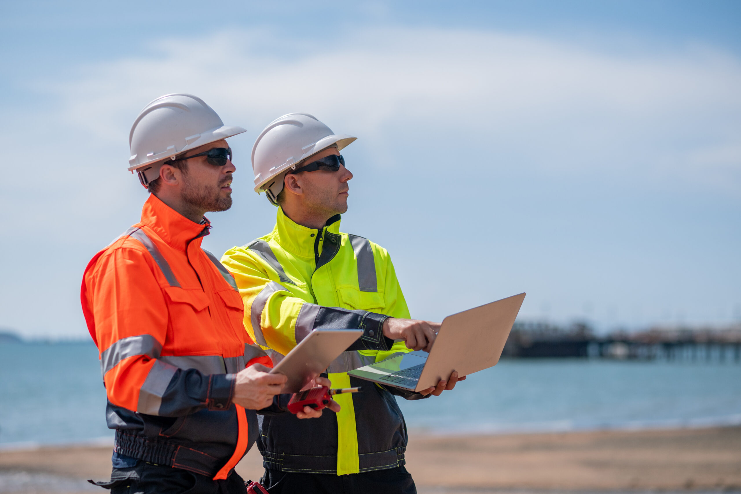 Industrial engineer inspection recording marine transport, offshore facilities energy managing operations while being mindful of sustainability and safety protocols in environmentally sensitive areas.