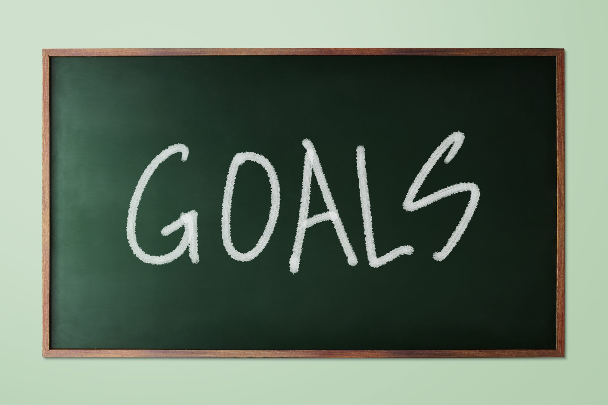 graphicstock-hand-drawn-goals-business-concept-on-green-chalkboard_Hu8eB5iDxsx-scaled